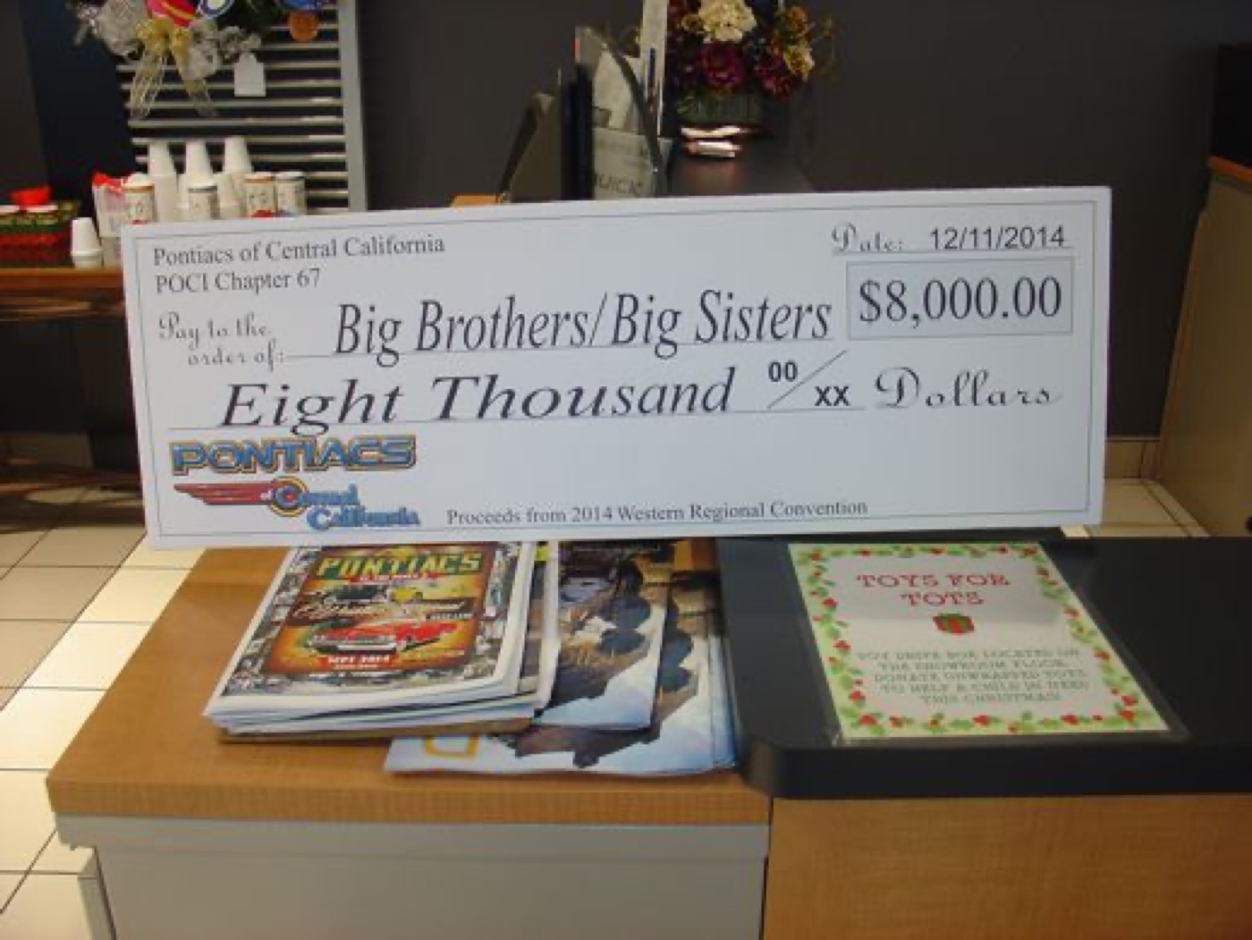 Big Brothers Big Sisters eight-thousand-dollar donation check