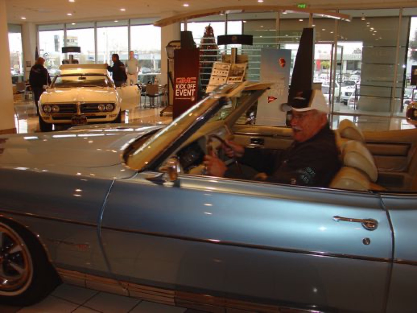 Grinning member enjoying the convertible driver seat