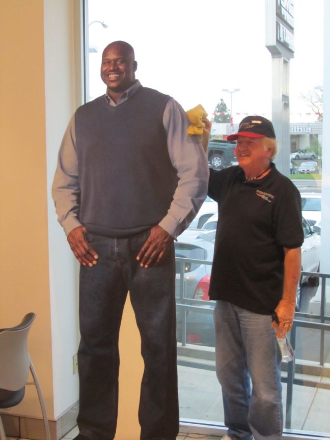 Member showing off blue Pontiac convertible
