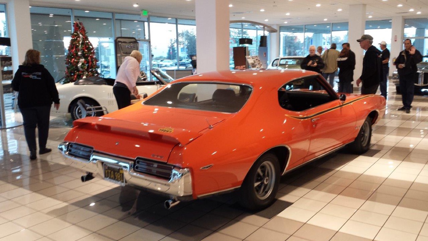 Vivid orange GTO shining on showroom floor