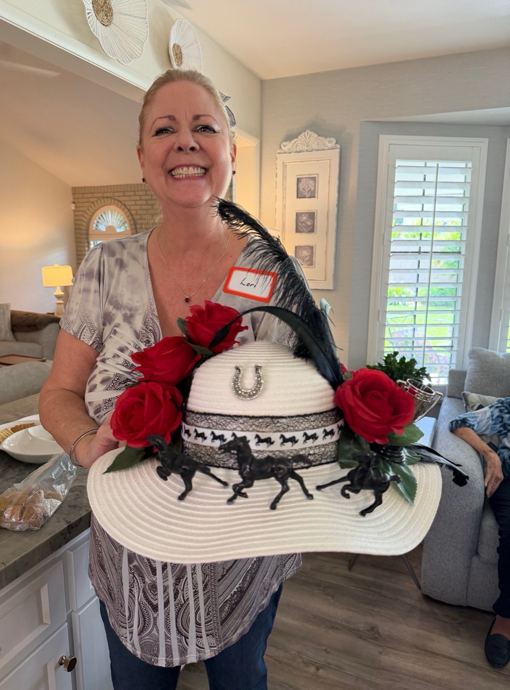 Proud member shows off her Derby hat